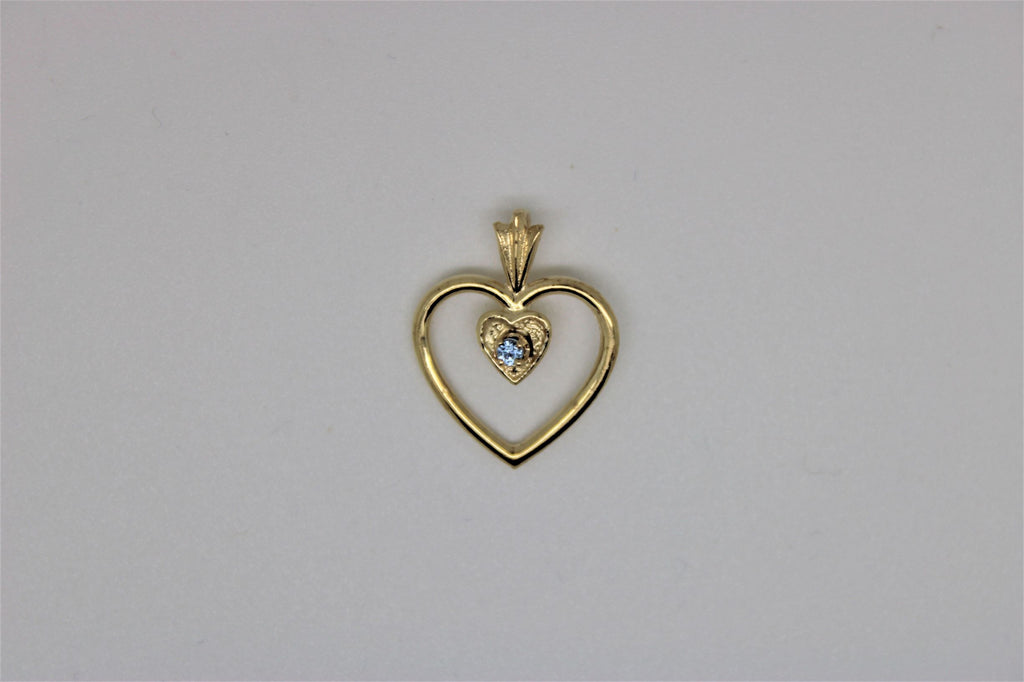 Double heart gold pendant with blue stone