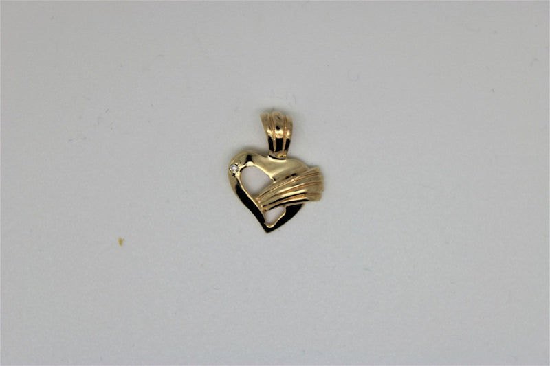 Gold heart pendant with a stone