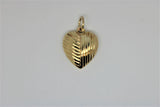 Lined gold heart pendant