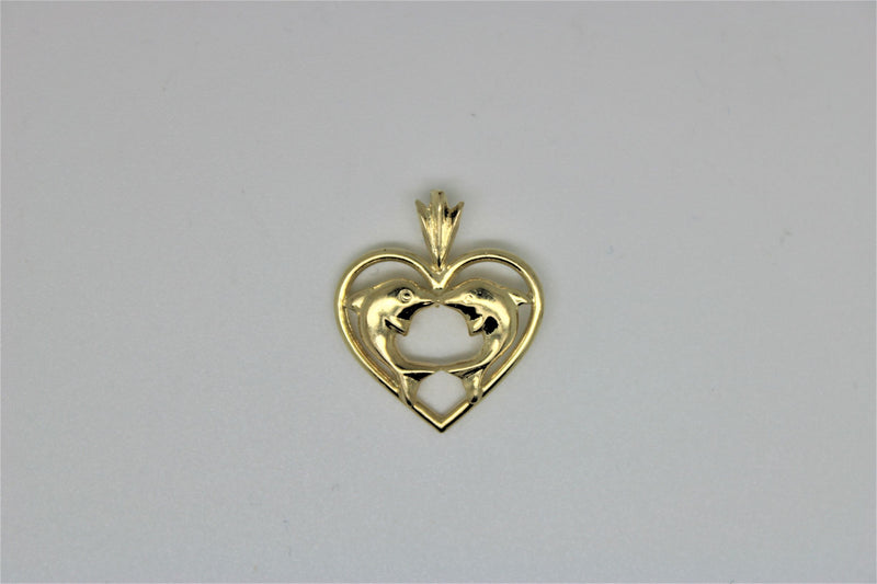 Gold heart pendant with dolphins