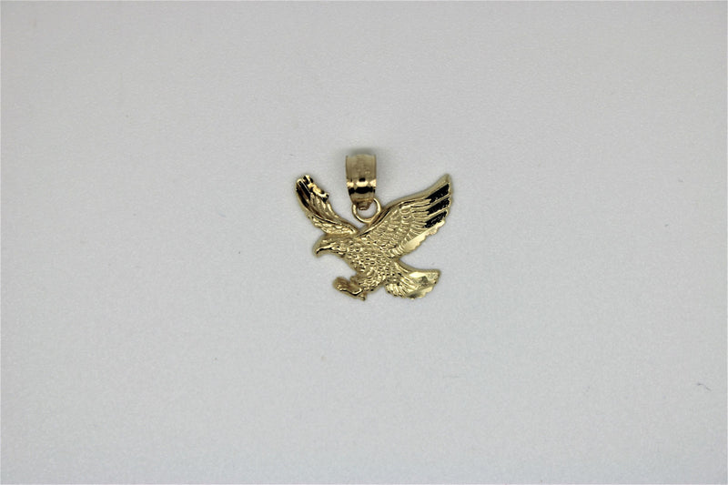 Gold bird pendant