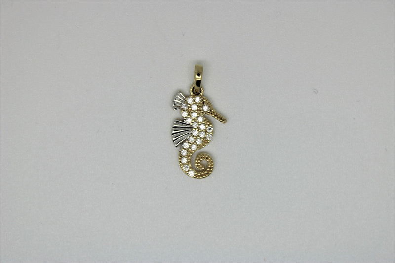 Gold seahorse pendant with stones