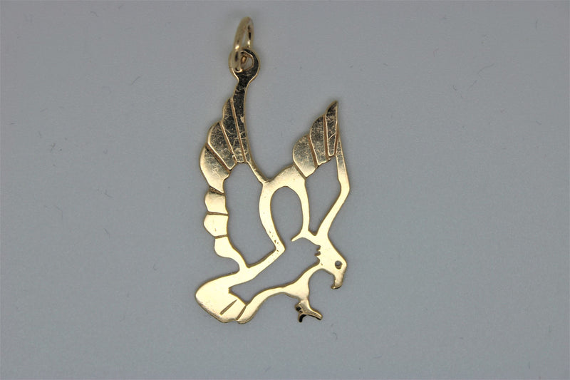 Gold bird pendant