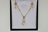 Set of gold chain, pendant and earrings with stones