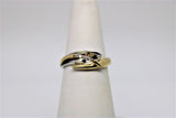 Engagement ring in 2 tone gold with 5 diamonds in the center