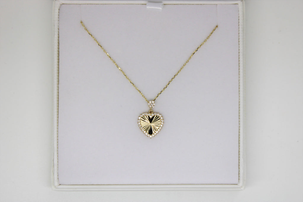 Gold chain with a heart pendant with stones