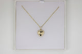Gold chain with a heart pendant with stones