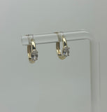 Boucles d'oreilles en or avec pierre dans le milieu