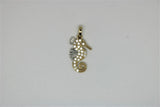Gold seahorse pendant with stones