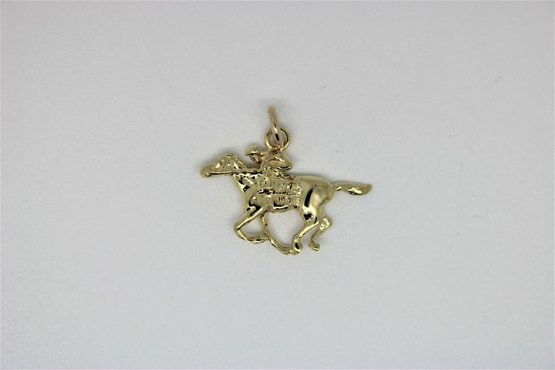 Gold rider pendant