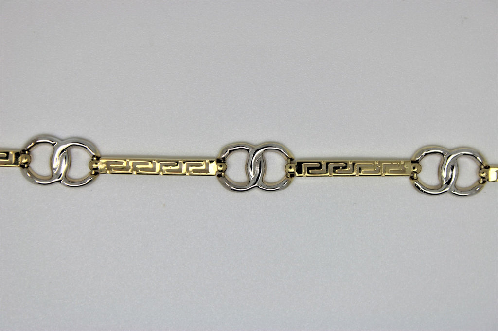 2-tone gold bracelet with crossed rings and versace motif