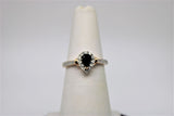 Solitaire rose gold engagement ring with black stone in the center