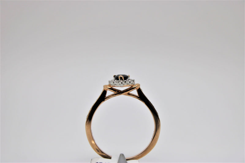 Solitaire rose gold engagement ring with black stone in the center