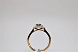 Solitaire rose gold engagement ring with black stone in the center