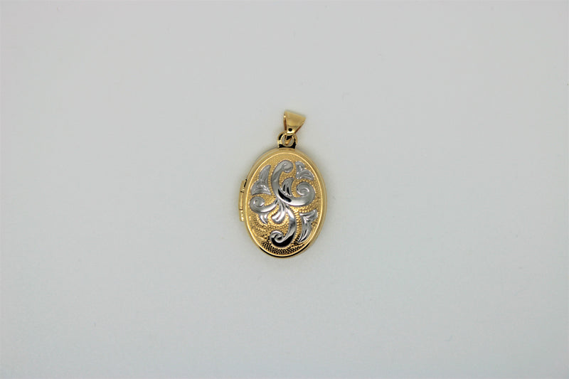2 tone gold oval pendant with motif