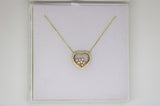 Gold chain with a heart pendant with stones