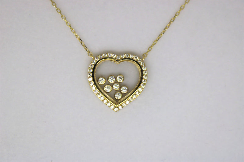 Gold chain with a heart pendant with stones
