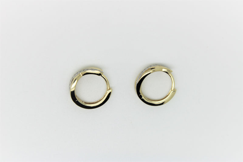 2 tone gold earring with a row of stones